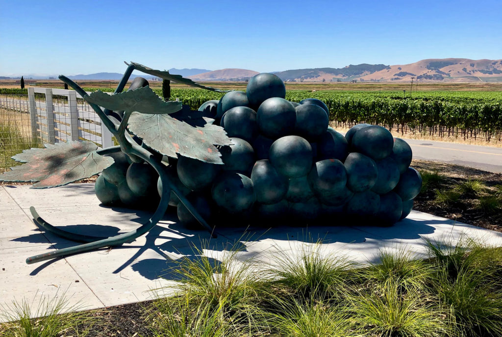 Grape sculpture, vines, and mountain view at The Donum Estate, Sonoma. 